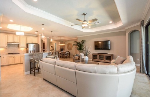 Naples House | Luxurious lakeview pool home in 5 Star Fiddler's Creek. Outdoor Dining & Kitchen