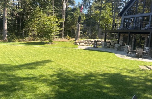 Woodgate House | Luxurious/Modern Adirondack home with gorgeous boathouse, sandbar & sunset view