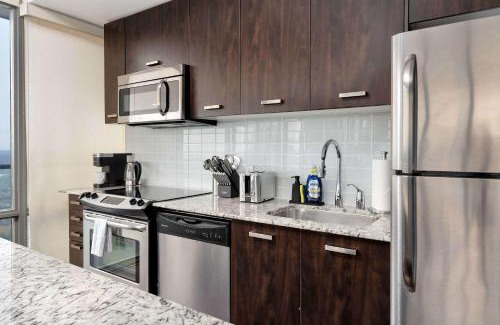 Bay Cloverhill Apartment | Luxury Bay Street Condo w Patio Sleeps 8