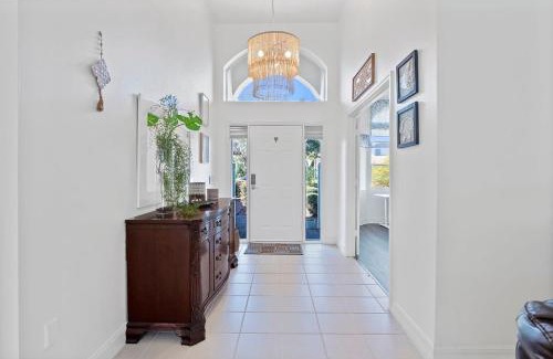 Palm Harbor House | Luxury Canal-Front Home with Heated Pool Spa Bicycles