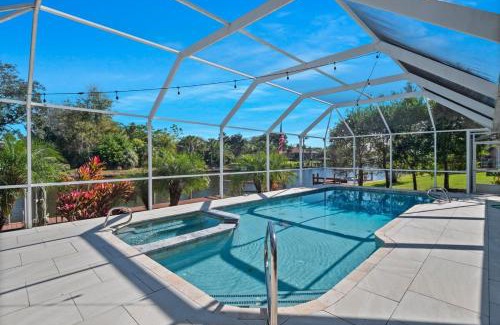 Palm Harbor House | Luxury Canal-Front Home with Heated Pool Spa Bicycles