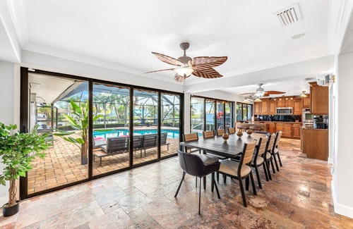 Cocoa Isles House | Luxury Canalfront Home w/Heated Pool, Game Room, Boat & Jet Ski Lifts