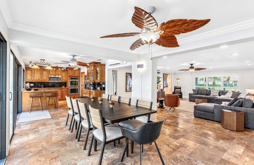 Cocoa Isles House | Luxury Canalfront Home w/Heated Pool, Game Room, Boat & Jet Ski Lifts