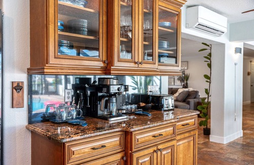Cocoa Isles House | Luxury Canalfront Home w/Heated Pool, Game Room, Boat & Jet Ski Lifts