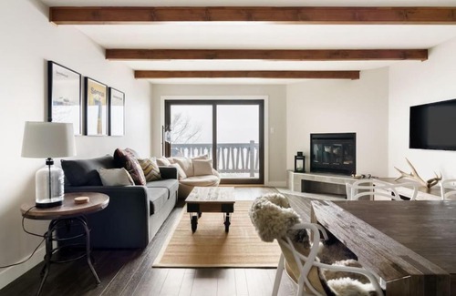 Mont-Tremblant House | Luxury Condominium with Rustic Minimalist Style
