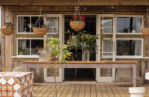 Pouto Cottage | Luxury eco-design waterfront fishing Batch with guests' vegetable garden.