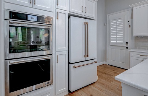 Cypress House | Luxury home with immaculate design, outdoor & chef's kitchen, home gym