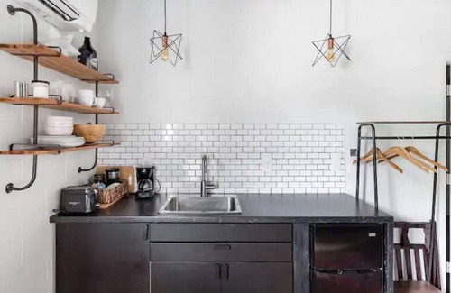 East Market District Apartment | Market #5 · Stellar Suites | Turquoise Suite in NuLu | Bikes