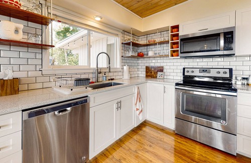 Poulsbo House | Mid-century home with stunning bay & mountain views, wraparound deck