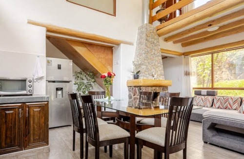 Huaran House | Modern and comfortable house with stunning views of the mountains and waterfall.