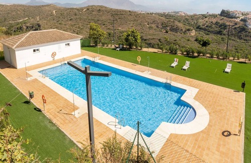 Puerto de la Duquesa House | Modern apartment in Manilva with shared pool and 5 minutes walk of the sea