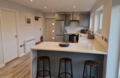 South Side House | Modern bungalow in a quiet lane in Guernsey. Private parking, private garden.