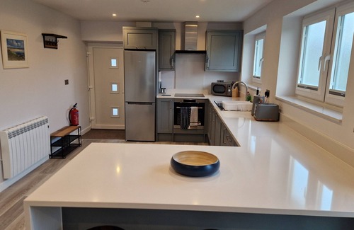 South Side House | Modern bungalow in a quiet lane in Guernsey. Private parking, private garden.