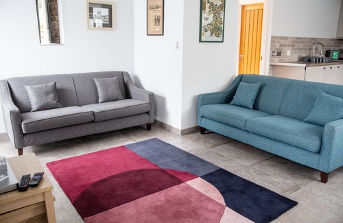 Margam Cottage | Modern Contemporary Cottage with Riverside Terrace and free WiFi