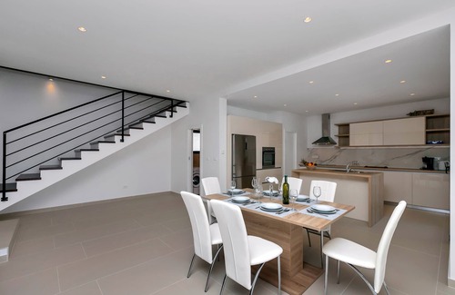 Bast House | Modern holiday home with infinity pool, three bedrooms, terrace, sea view