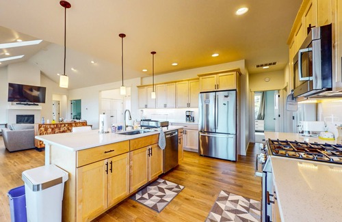 Union House | Modern home with fireplace, private patio, remote workspace, & golf nearby