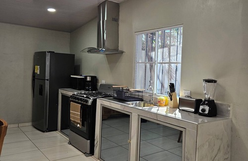 Caluco House | Modern House near a river "La Casita Cruz"