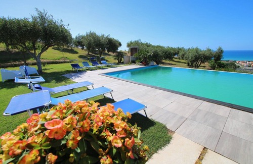 Campofelice di Roccella Villa | Modern property with Private Golf Practice, Private Pool, Garden, WiFi, Sea VIew