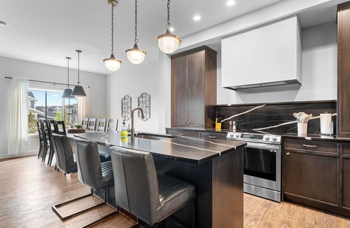 Cochrane House | Modern Luxury Retreat | 4BR w Hot Tub, Garage
