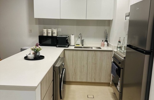 Sharjah Apartment | Modern sanctuary with pool and gym access in downtown aljada