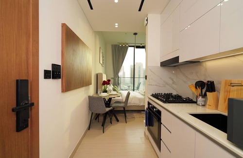 Jumeirah Village Circle Apartment | Modern Studio with Balcony Views of FIVE Hotels