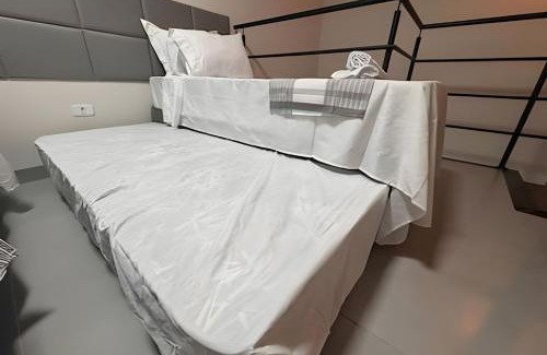 Jacarezinho Villa | Moderno Loft com ar condicionado e vaga