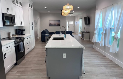 Foley House | Near Sports Complex, OWA, beaches, shopping, restaurants. King bed.