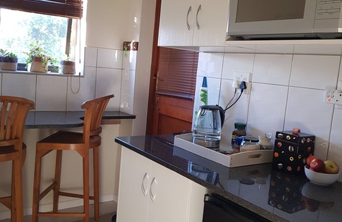 Somerset West House | Neat, modern, comfy and secure apartment with a leafy garden and parking.