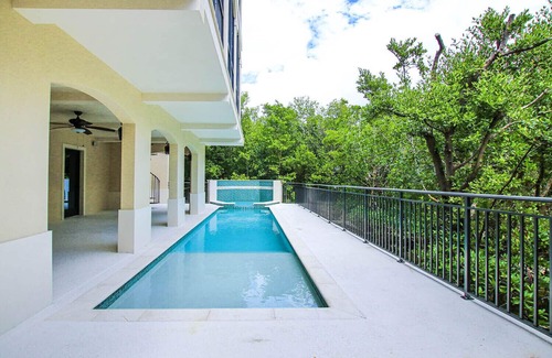 Wulfert House | New Bayfront Luxury Home with Private Pool, Spa & Panoramic Views