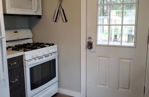 Traverse City Cottage | New Listing! 3br cottage on Lake Leelanau with beach, boat launch, playground!
