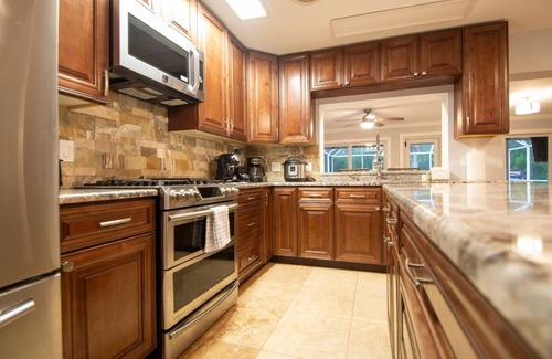 Fort Myers House | NEW! Waterfront Heated Pool, Kayaks, Fishing Pier, Fire Pit w/office