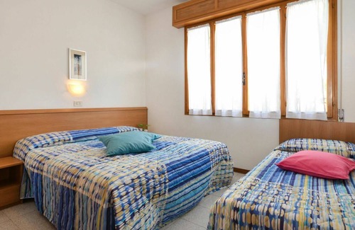 Lignano Pineta Apartment | Nice apartment for 4 guests with WIFI, A/C, pool, TV, terrace, pets allowed and parking
