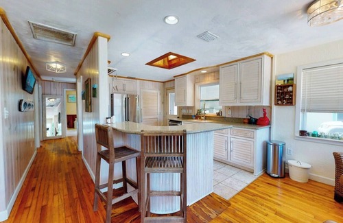 New Smyrna Beach House | North Beach rental! 2 Bedroom, 1 flex room and 1 bath home, just one block from beach access and Grayce Barck Park with nature trails.