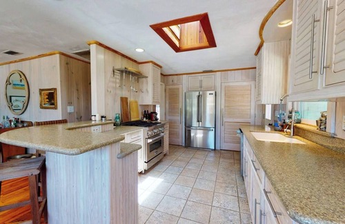 New Smyrna Beach House | North Beach rental! 2 Bedroom, 1 flex room and 1 bath home, just one block from beach access and Grayce Barck Park with nature trails.