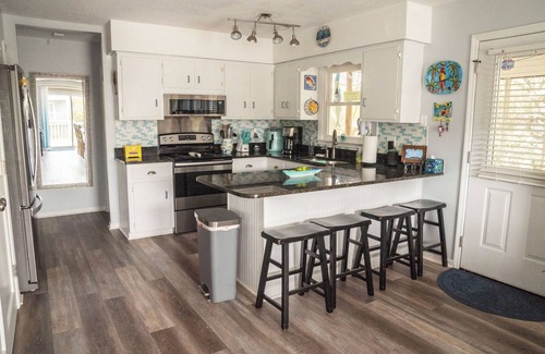 Emerald Isle Cottage | Ocean view family cottage, just steps from the sea and close to everything.