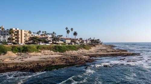 Village of La Jolla Apartment | Oceanfront in La Jolla Steps to Beach Shops Dining Dawn Patrol by AvantStay