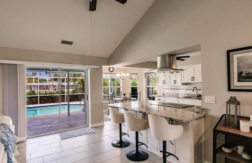 Fort Myers House | Offering breathtaking views of the sun setting over the water.