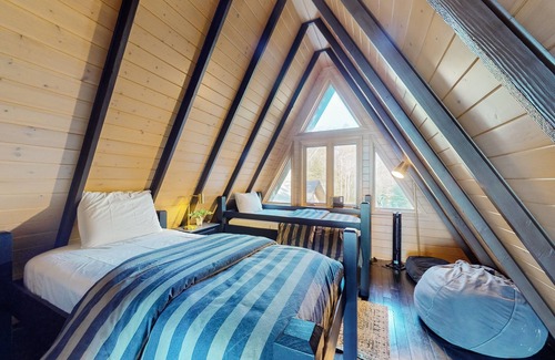 Eagle River House | One-of-a-kind lakefront A-frame overlooking Echo Lake with theater room
