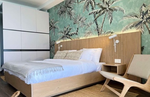 Kfardebian House | Palm Paradise: Beachfront Exotic Room in Batroun