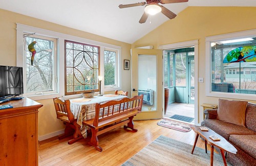 Sylvan Shores Cottage | Peaceful wooded cottage with seasonal lake views, WiFi, private parking, & patio
