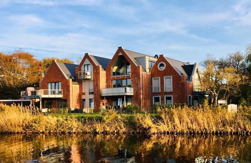 Carolinensiel Apartment | ☼ Penthouse on the Harle ☼ Uniquely beautiful living right on the water + sauna, fireplace
