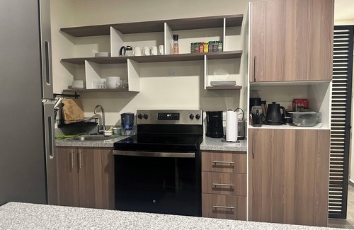 Santa Tecla Condo | Penthouse with Volcano Views & Top Amenities - AC, Gym, Lounge, Patio, Workspace