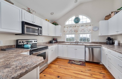 Sea Scape House | Pet-friendly Kitty Hawk home with private heated pool, volleyball court, and more
