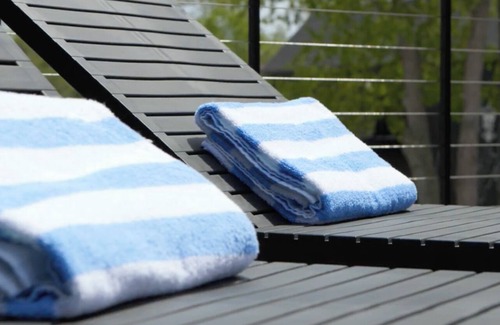 Bellaire Apartment | Pet-Friendly Studio in New Boutique Resort w/Hot Tubs, Sauna, Fire Pit, & More!