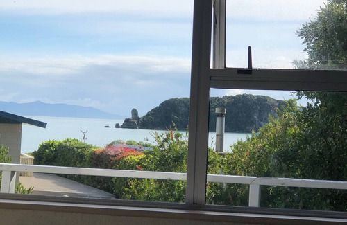 Tata Beach House | Pet friendly yard, great Sea Views and just across the road from Tata Beach