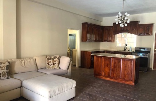 Runaway Bay Apartment | Pool View Two Bedroom Apartment with En-Suite, Open Kitchen and Living Room