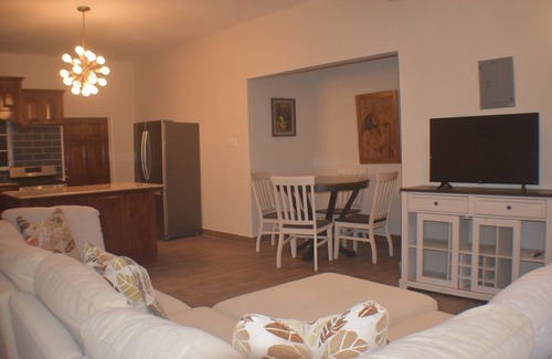 Runaway Bay Apartment | Pool View Two Bedroom Apartment with En-Suite, Open Kitchen and Living Room