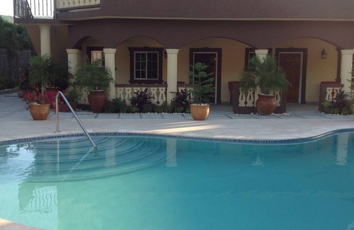 Runaway Bay Apartment | Pool View Two Bedroom Apartment with En-Suite, Open Kitchen and Living Room