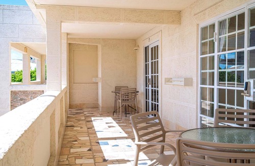 St. Lawrence Gap Apartment | Poolside Studio, Shared Patio and Hotel Amenities