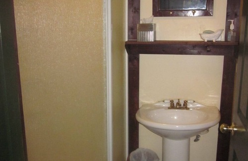 Pembine Bed & Breakfast | Private Victorian Cottage-themed room with shared baths/ kitchenette